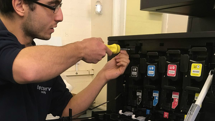 Technician installing toner